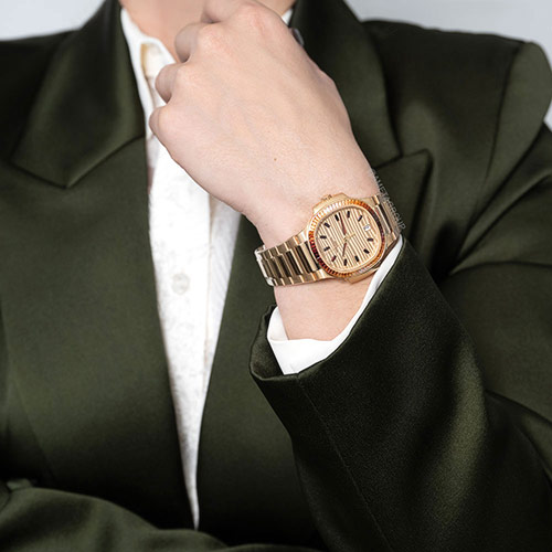 Patek Philippe Nautilus Joaillerie, 18K Rose Gold, Spessarite Bezel, Baguette Dial